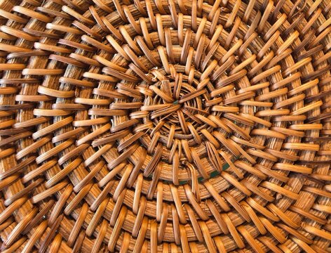 Close-up textured pattern of woven rattan material.