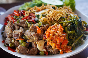 Assorted Stir-Fried Vegetables, Indonesia, captured on May 29, 2025. A mix of traditional Indonesian vegetable dishes cooked with garlic, chili, and local spices