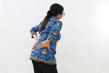 Side view of civil servant woman suffering from back pain.