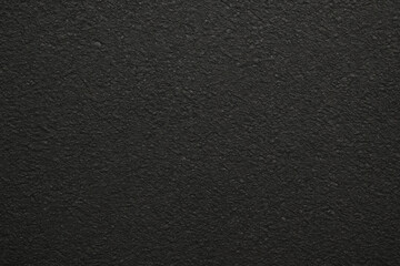 Obraz premium Bright red apple on black textured background.