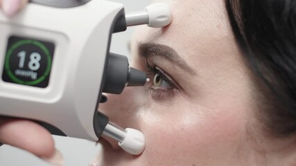 A device for measuring intraocular pressure. Close-up of the eye during diagnosis. The concept of ophthalmologic diagnosis and treatment.