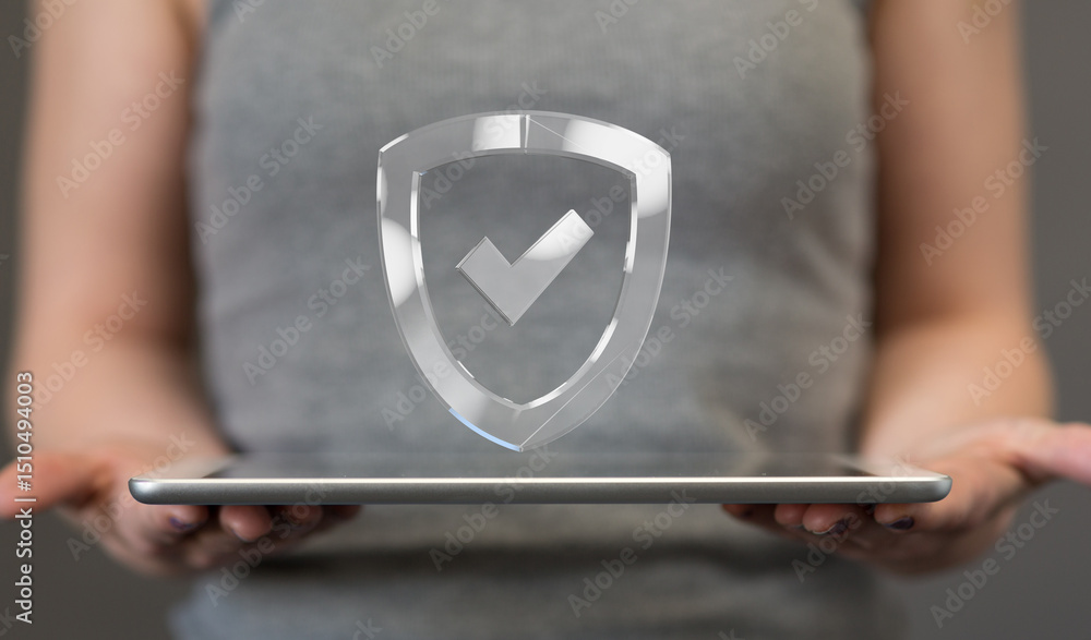 Poster Image of a person holding a tablet with a digital shield and checkmark, representing data security and protection.
