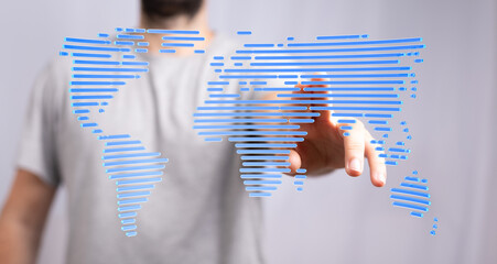Person touching a digital world map, illustrating global connection and technology.