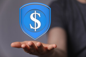 Hand holding a digital shield with a dollar sign, symbolizing financial security and protection.