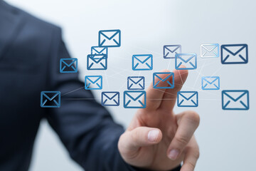 Businessman interacts with digital email network.  Concept of global communication, connection, and networking.