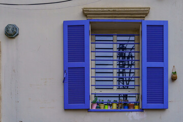 Typical window with blue shutters, in Jaffa