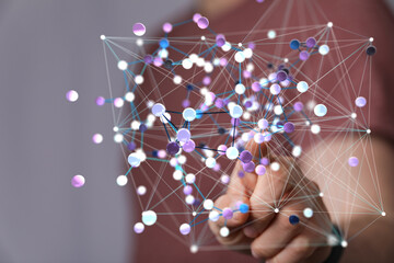 Person interacts with a digital network.  Concept of connection, data, technology.