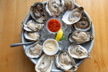 SOlomons, Maryland USA A dozen oysters on the half-shell on ice.