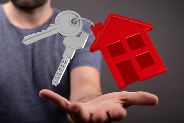 Image of a person holding house keys, symbolizing homeownership, real estate, and property.