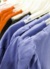 Colored t-shirts on hangers