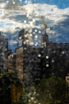 Fototapeta New York, New York, USA A classic New York watertower seen through a rainy window.