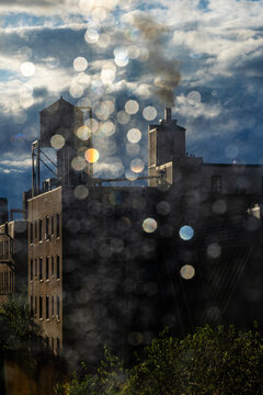 Fototapeta New York, New York, USA A classic New York watertower seen through a rainy window.