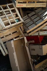 Messy crates pile for packaging context. Useful for waste, recycling, or storage image searches.