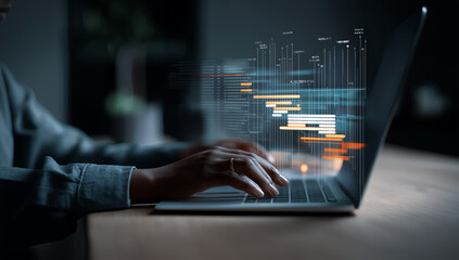 Business professional analyzing big data visualization on laptop computer screen