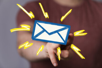 Hand pointing at email icon, new message alert. Digital communication concept.