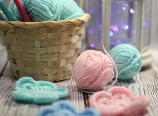 Crocheted flowers and clews and hooks and scissors handmade decor photo