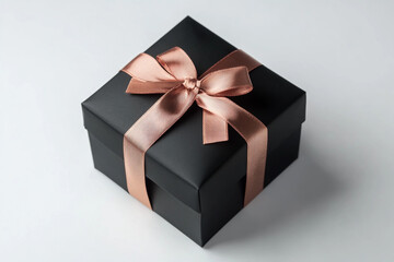 Black gift box with a copper ribbon, a white background, with no shadow