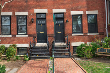 doorway with two doors in a brick townhouse in downtown Washington, DC.