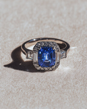 diamond engagement ring in silver with a blue diamont