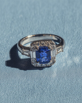 diamond engagement ring in silver with a blue diamont