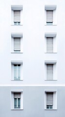 Obraz premium Close-up of smooth minimalist white facade with symmetrical windows and soft reflections