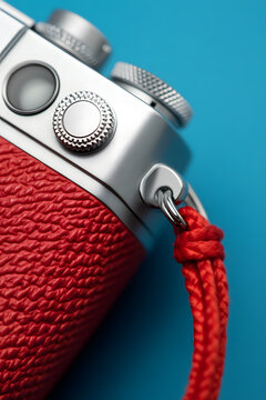 Modern digital camera close up with cable and flash