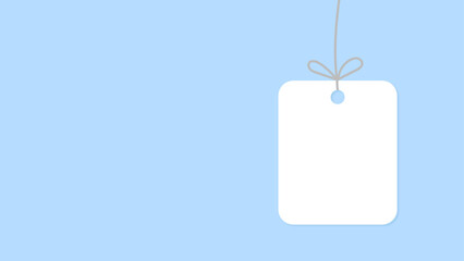 White rectangular tag with rounded corners hanging from a string with a bow on a soft blue background.