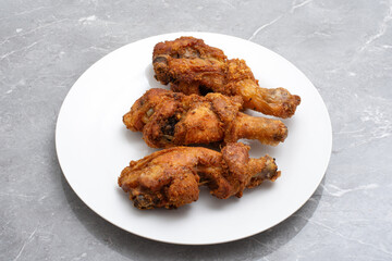 Traditional indonesian fried chicken with spices ayam rempah