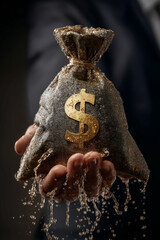 Hand of businessman holding a money bag with leaking water, Leaking money bag, Money loss and financial crisis, Currency crisis, Exchange rate drop