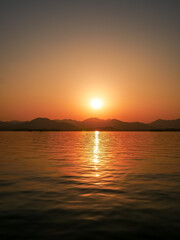 Sunset scenic view with the boat at Xihu(west lake),located at hangzhou city in Zhejiang province,China