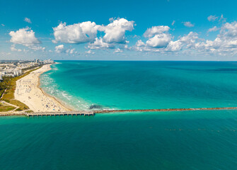 Aerial view of Miami Beach marina with turquoise waters. Miami cityscape with luxury yacht. View of...
