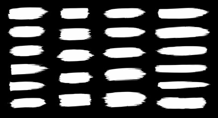 Obraz premium Various Shape White Paint Brush Strokes on Black Background