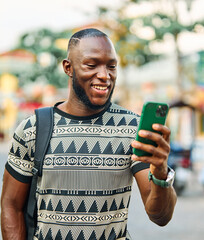 Portrait of a young black man guy talking discussing on smart phone, answeing the phone, having fun...