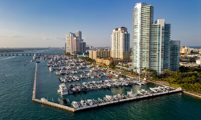 Obraz premium Aerial view of Miami marina skyline with yacht. Drone shot of Miami cityscape.