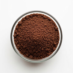 Brown sugar in a borosilicate glass bowl isolated on a white background
