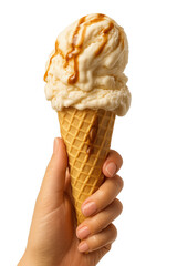 Delicious ice cream cone held in hand with caramel drizzle topping in bright setting