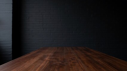 A polished dark wood table extending into a stark black brick wall background