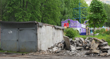 Demolition of old concrete garages in the courtyard of an apartment building, Iskrovsky Prospekt, Saint Petersburg, Russia, May 29, 2025