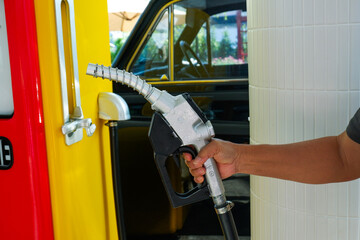Close up fuel nozzles at gas station,Petrol pump filling fuel nozzle in gas station,Fuel Pump,Gas...