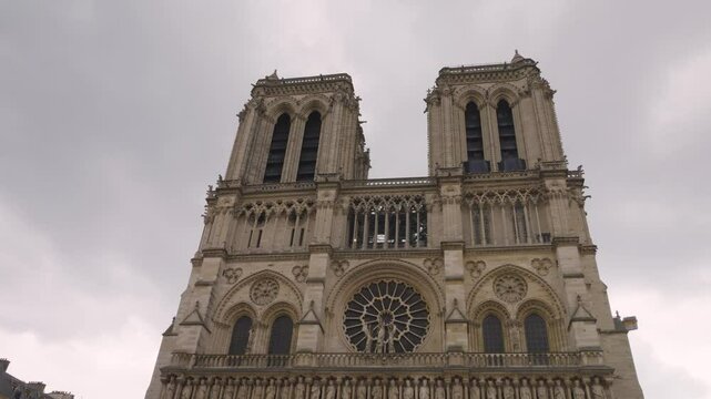 View on the medieval Catholic cathedral church Notre-Dame de Paris in French Gothic style at the Place Jean-Paul II on the island Ile de la Cite, 4th arrondissement of Paris, France.