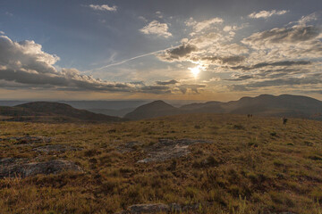 mountains sun hikers land landscape scenery view