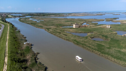 Porto Tolle is located between the Po di Maistra and Po di Gnocca rivers and is cut in half by the Po di Venezia (Parco regionale del Delta del Po)
