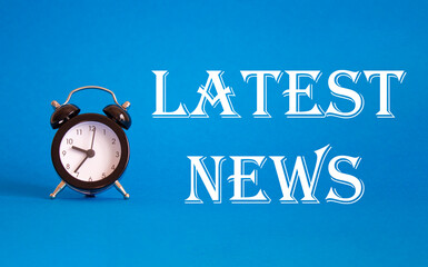Latest News symbol. Concept word Latest News on Beautiful blue background with alarm clock. Business and Latest News concept. Copy space