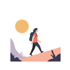 Woman walking uphill trail in sunny landscape with plants  