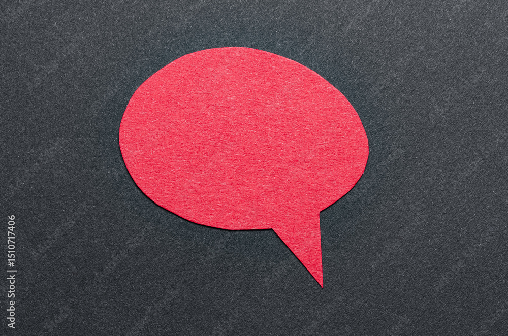 Poster red cut out blank paper speech bubble of round shape with copy space for text on dark background, fl