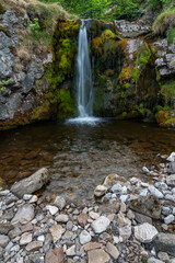 Waterfall with moss covered rock texture