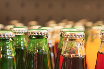 Colorful glass bottles arranged on display in a modern shop