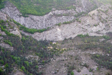 A small house located on a mountain.