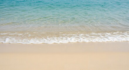 Gentle waves on a tropical sandy beach