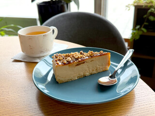 Slice of Caramel Walnut Cheesecake Served with Green Tea. Afternoon Tea Theme. Manual Phone Photography, Selective Focus, No AI
